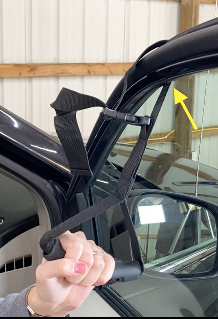 roll up car window to secure window strap