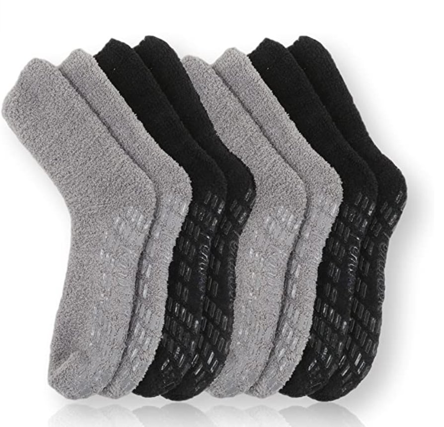 A set of non-slip socks in black and gray colors, arranged in alternating pairs. The socks feature textured grips on the soles for improved traction, ideal for preventing slips on smooth surfaces. Made with a plush, soft material, they provide both warmth and comfort, suitable for indoor use. Lower Body Dressing After Hip Replacement Surgery