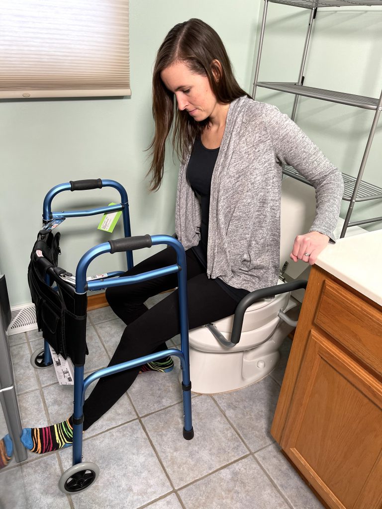 Slowly lower yourself onto toilet - Toilet Transfer Hip Replacement