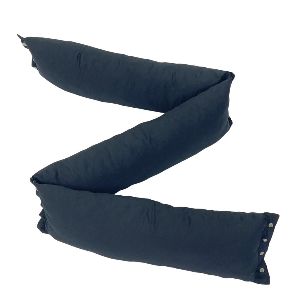 EOT Wellness modular positioning pillows in black, shown connected and shaped into a Z configuration against a white background.
